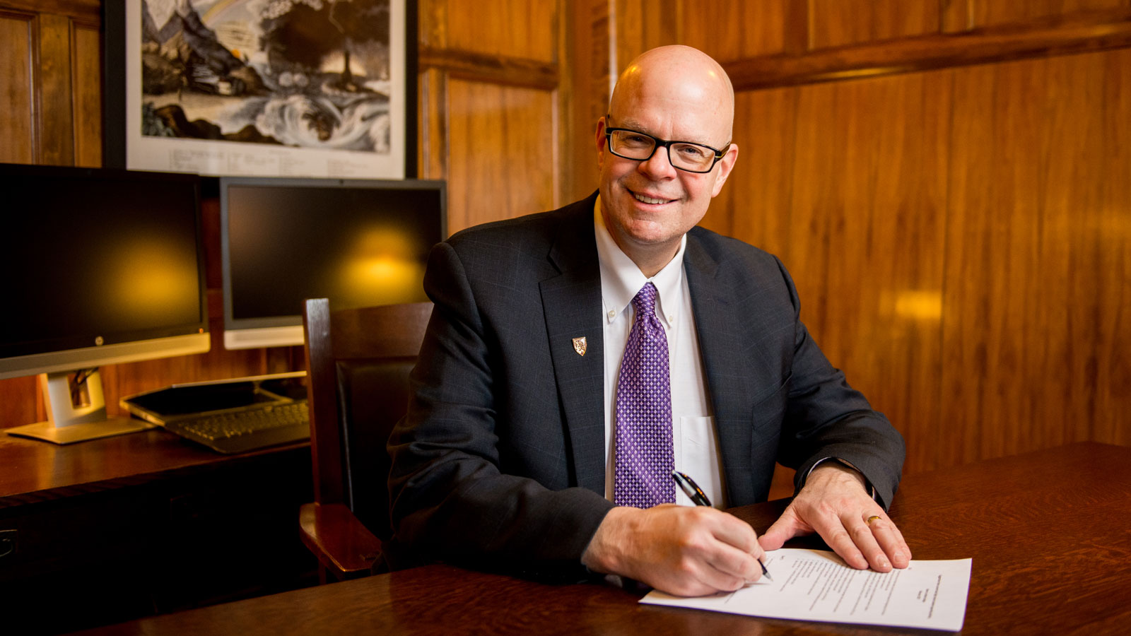 Dr. Cech Signing a document