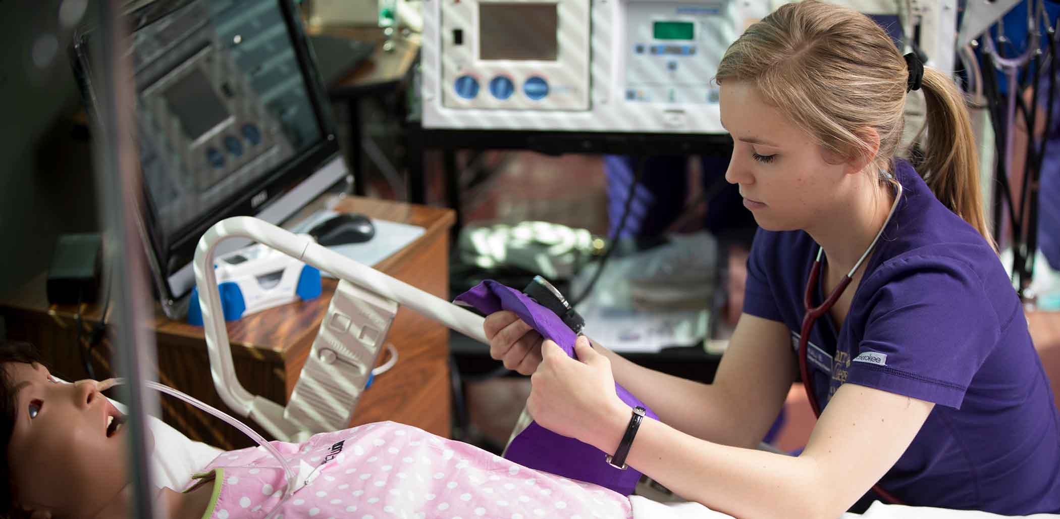 Nursing student with simulated patient