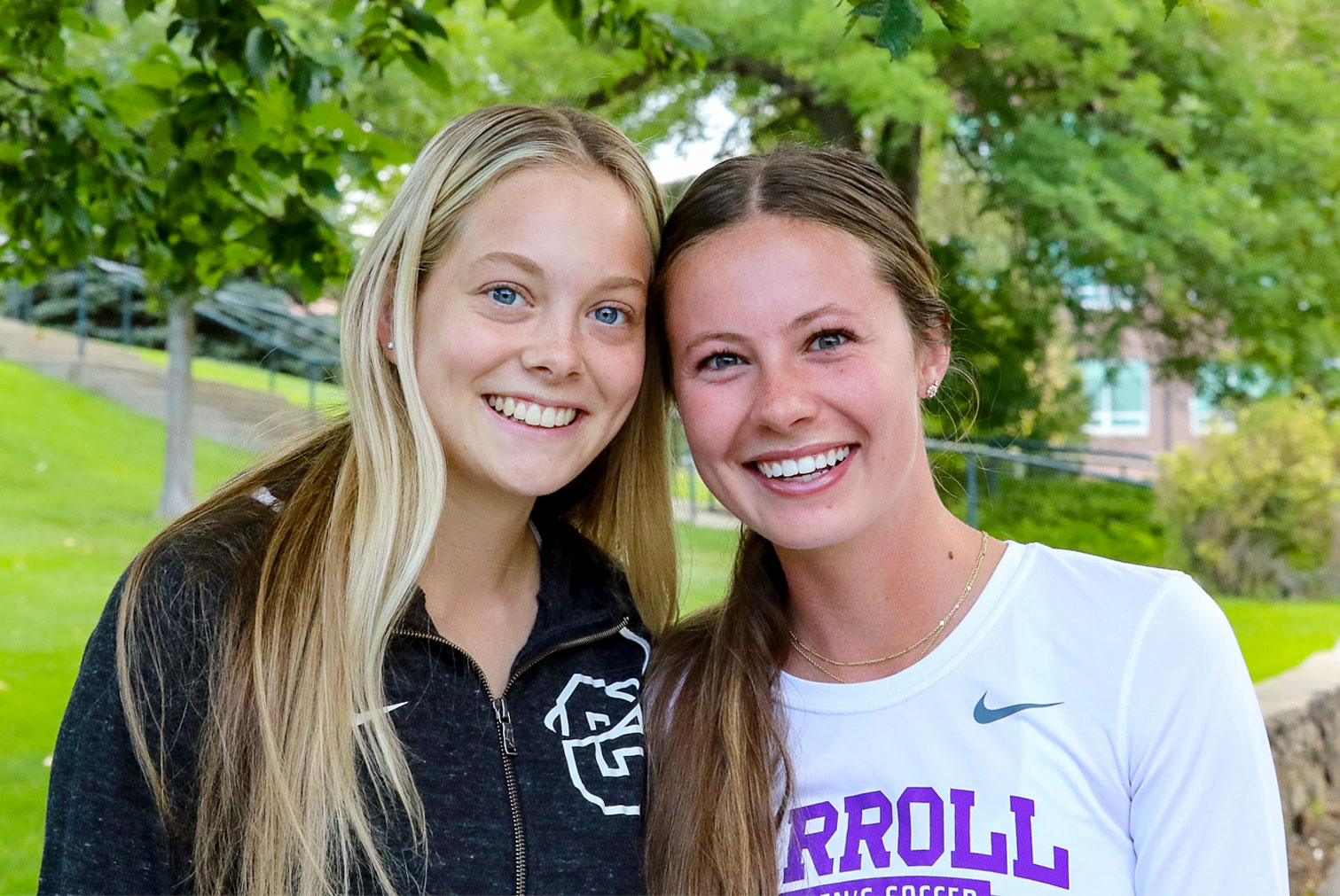 Two female Carroll students smiling