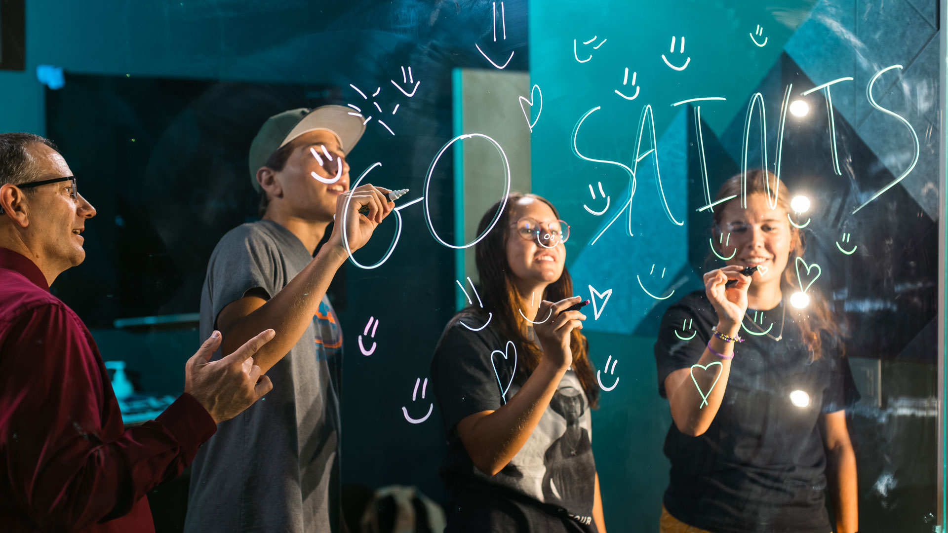 Students Writing on Glass in Class