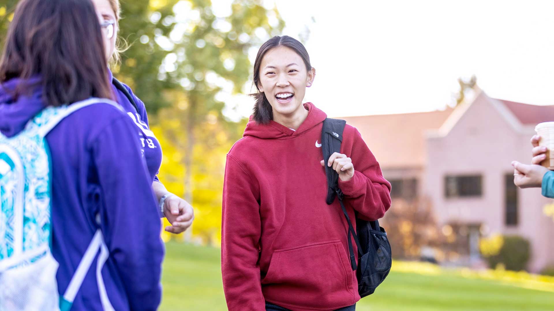 Female student on campus smiling