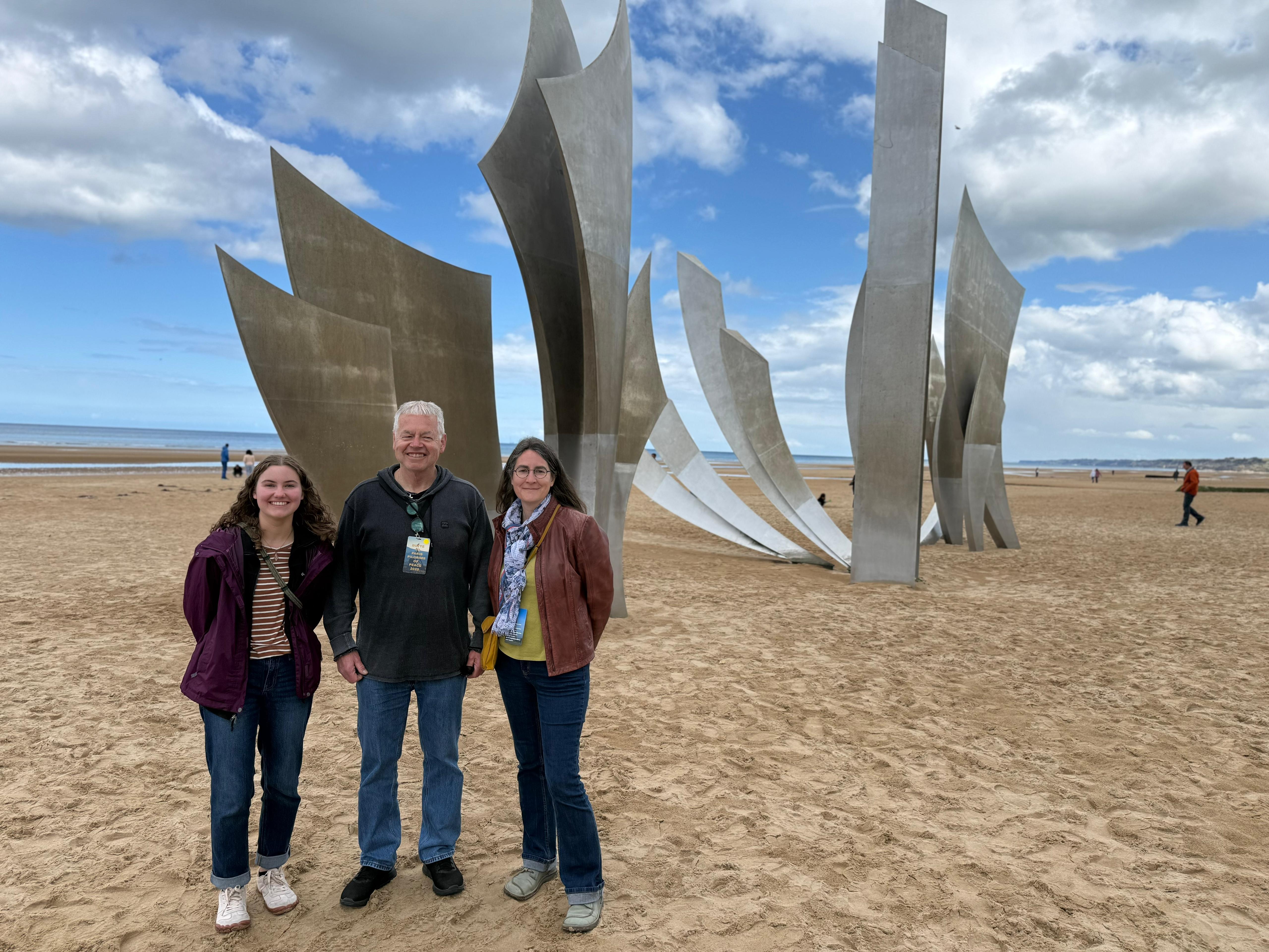 Mary, Fr. Beretta and Dr. Crohas at Omaha Beach