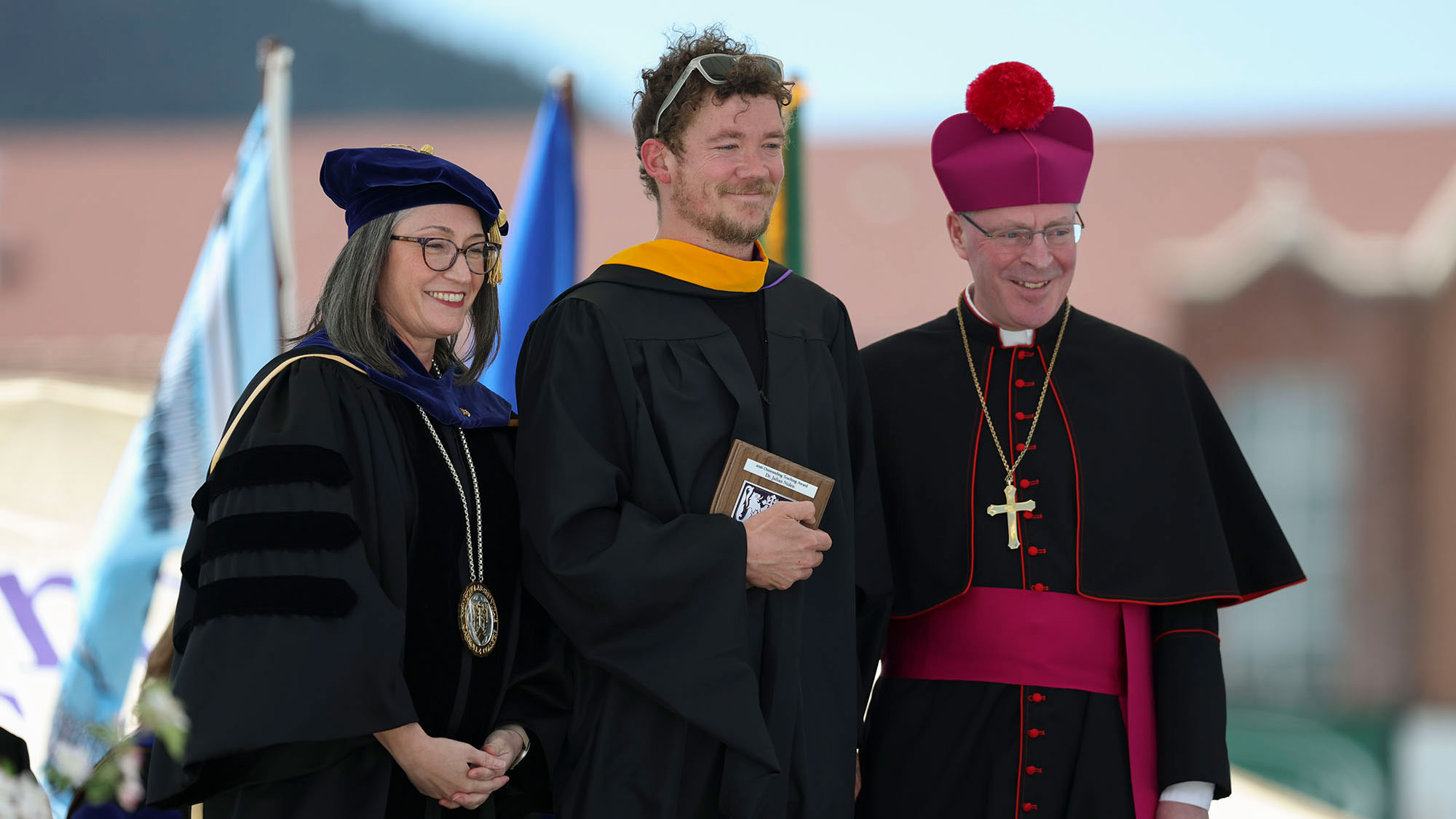 Dr. Julian Nolan (center) with Co-Presidents Dr. Jennifer Glowienka and Bishop Austin A. Vetter