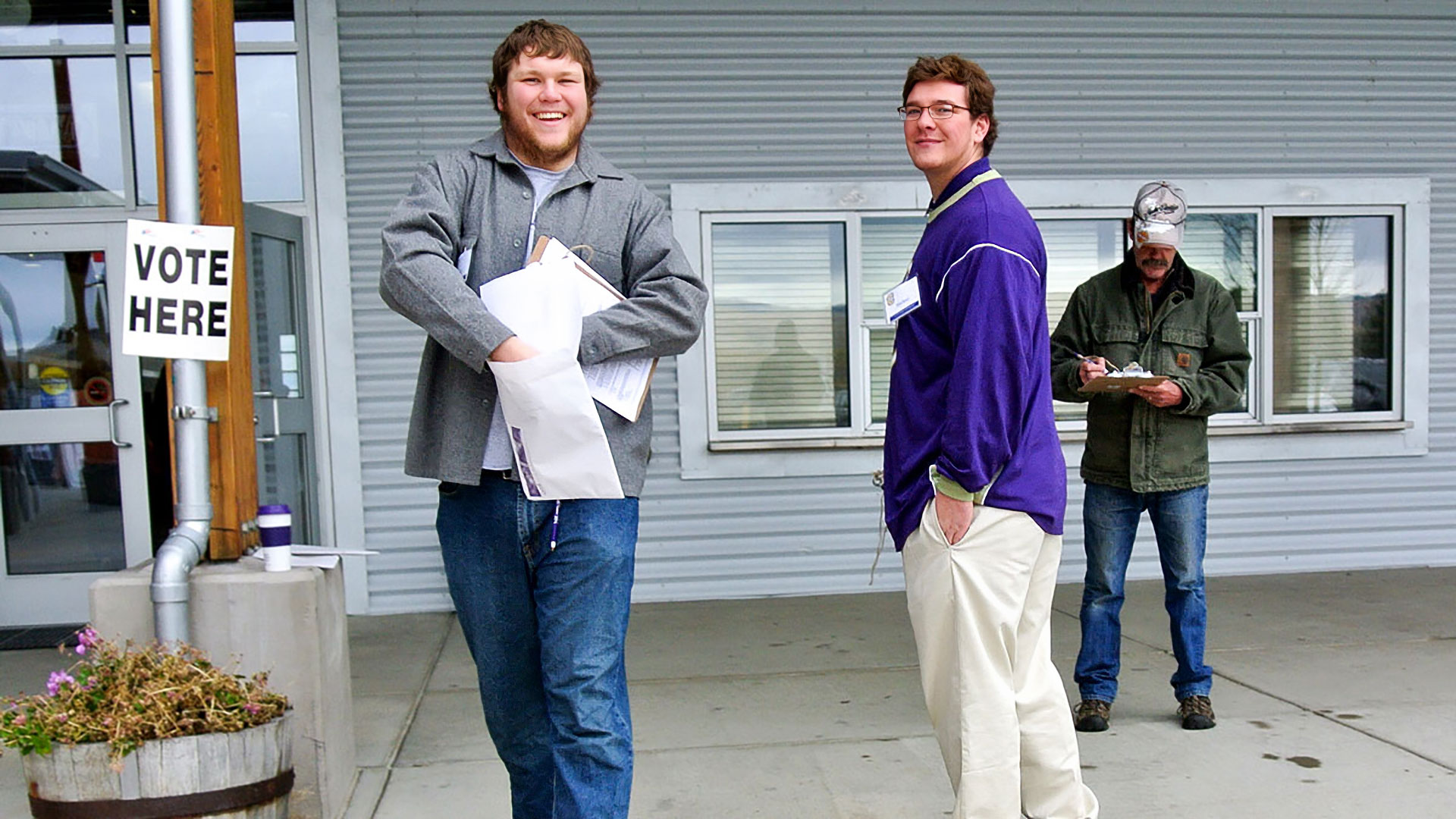 Two males students polling at voting station