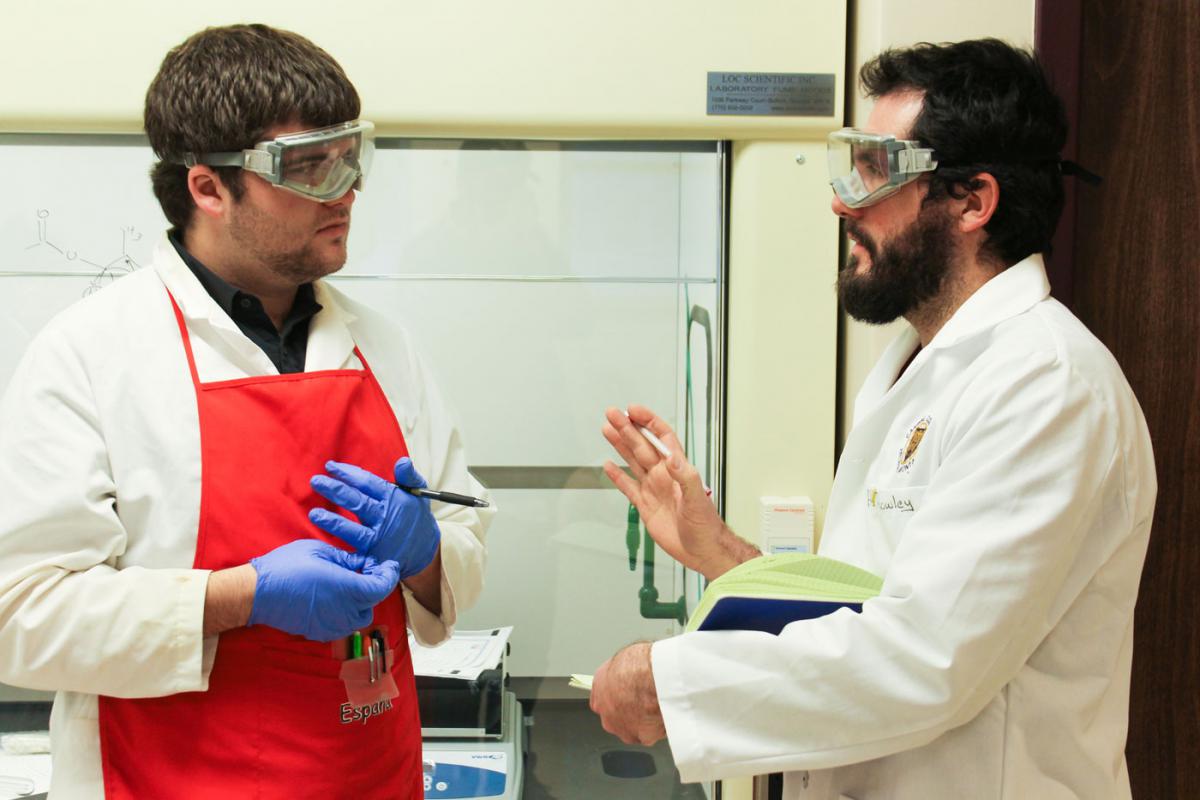 Dr. John Rowley with a student in the Chemistry Integrated Lab
