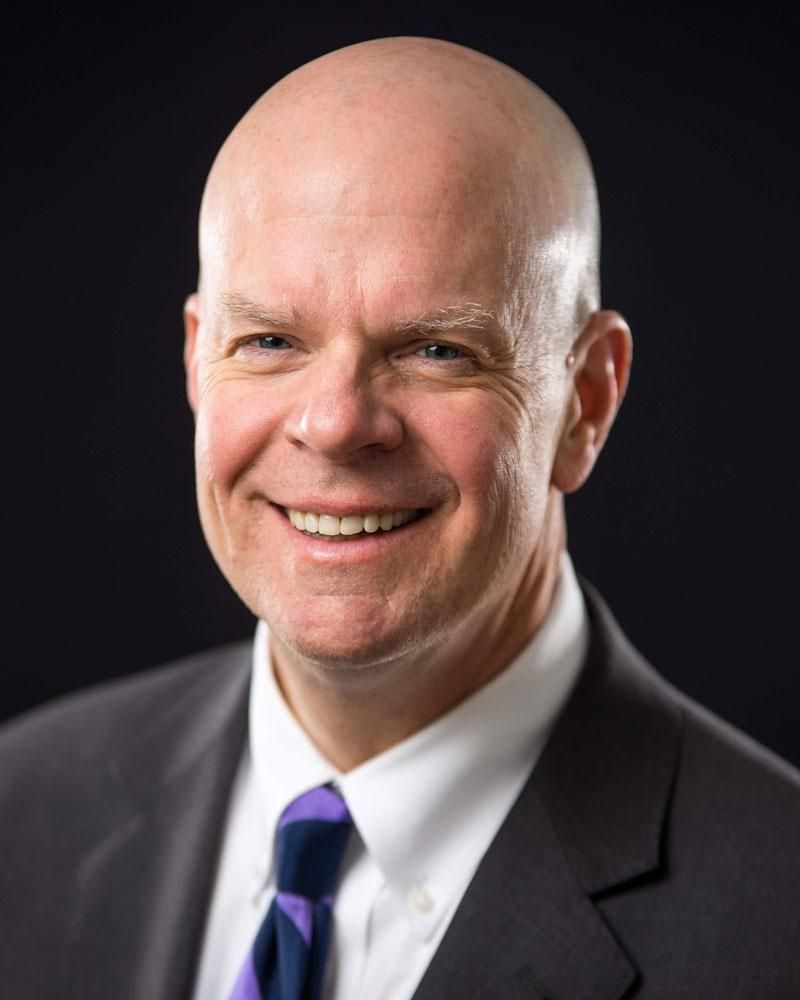 Dr. John E. Cech