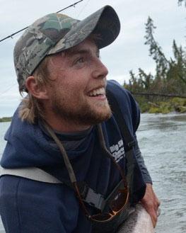 Angelo Brennan fishing on a river
