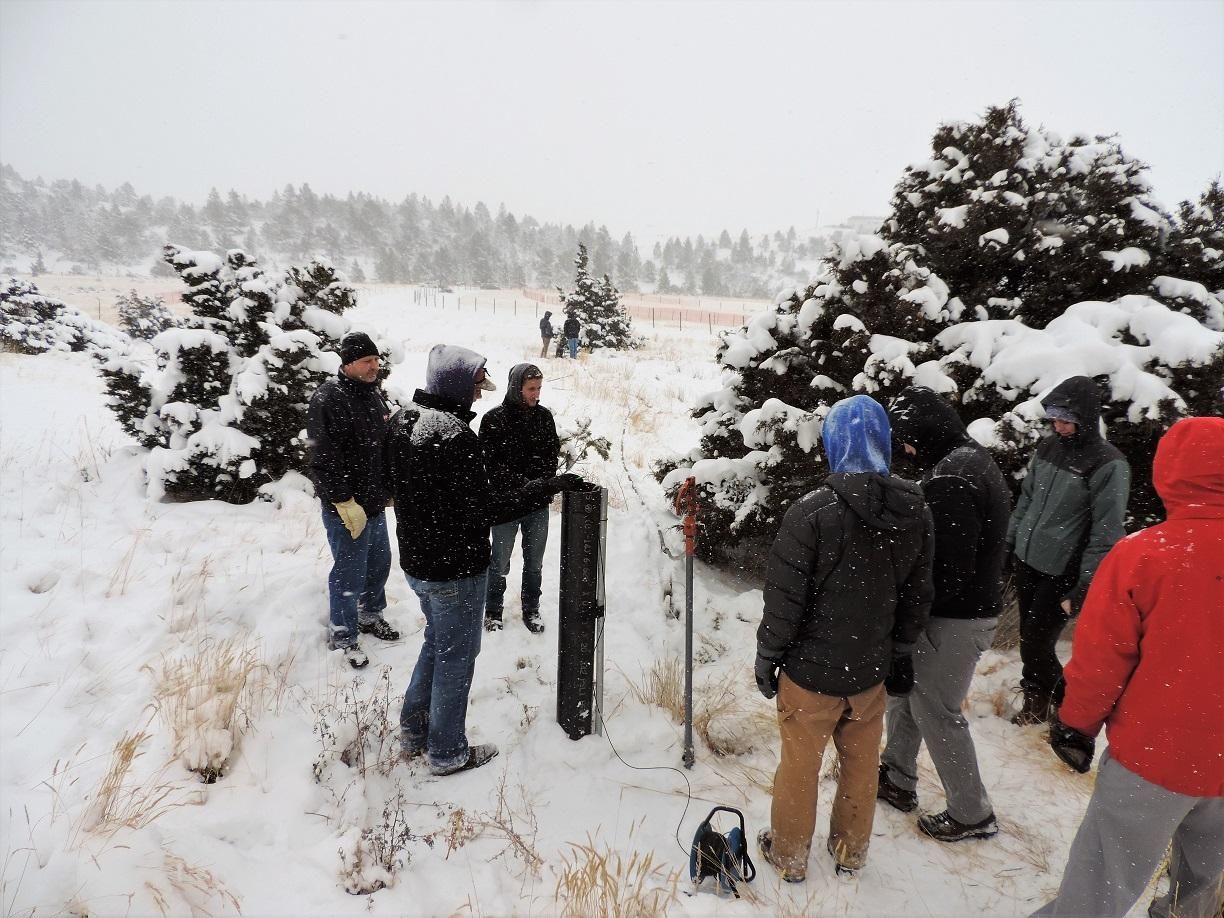 Hydrogeology Students gather in the snowy outdoors to do field work