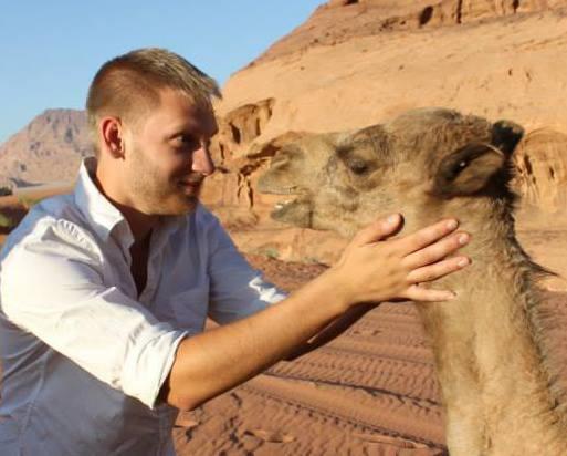 Snapshot of Alex Gaiser with a Camel