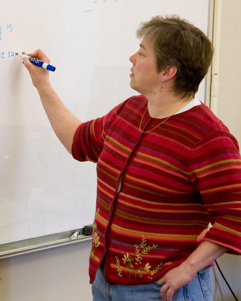 Mary Keeffe Writing on a White Board