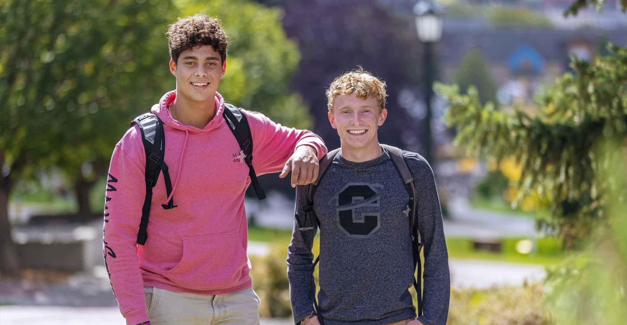 Two Male Students Smiling Outside